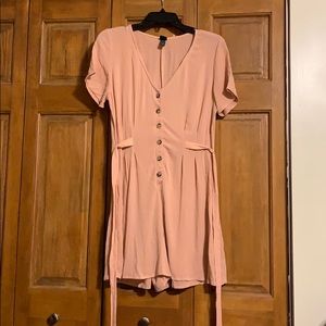 Pink button up romper with tie detail